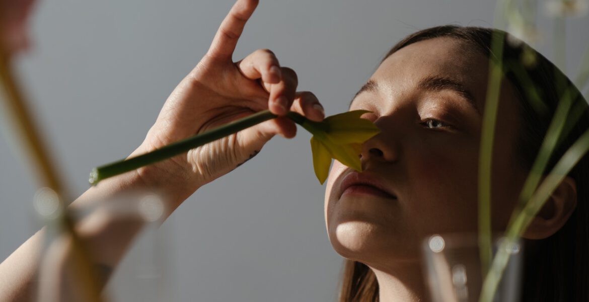 Woman is checking her ability to smell