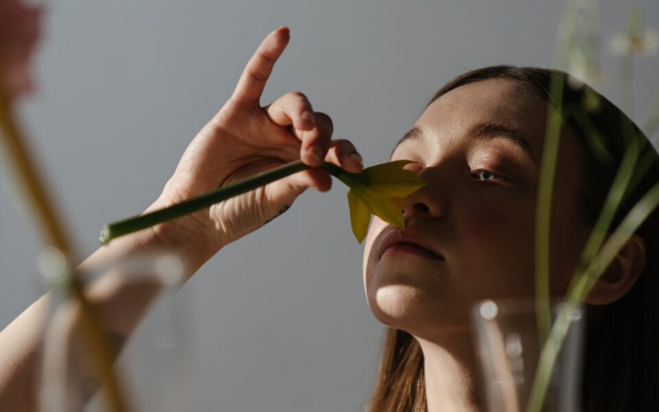 Woman is checking her ability to smell